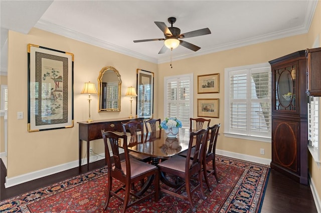 dining space with baseboards, wood finished floors, and ornamental molding