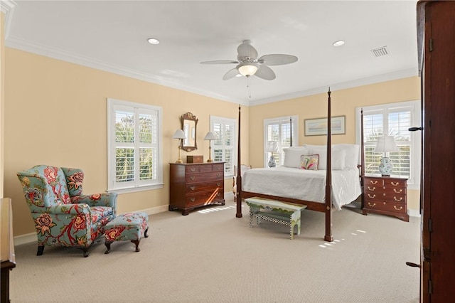 carpeted bedroom featuring recessed lighting, visible vents, crown molding, and baseboards