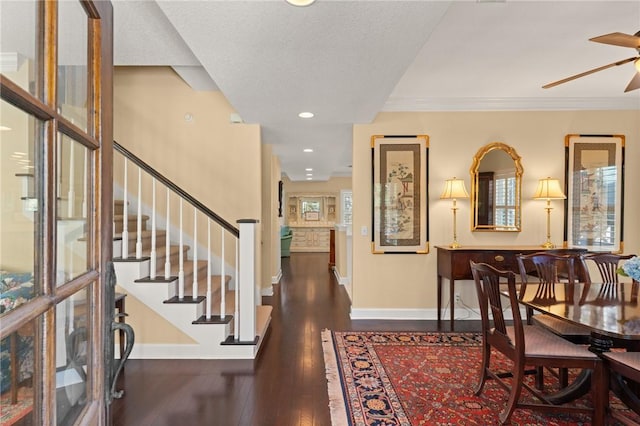 foyer entrance featuring crown molding, recessed lighting, wood-type flooring, ceiling fan, and baseboards