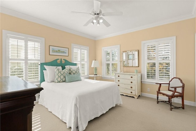 bedroom with light carpet, ornamental molding, a ceiling fan, and baseboards