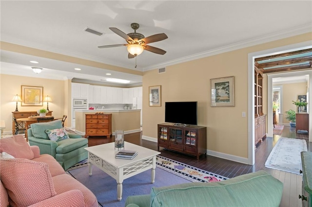 living area with dark wood-style floors, baseboards, visible vents, and crown molding