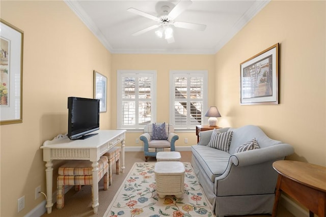 sitting room with ornamental molding, light colored carpet, ceiling fan, and baseboards