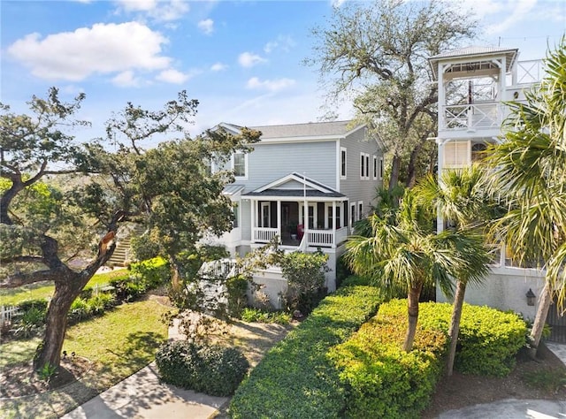 view of front of house featuring a sunroom