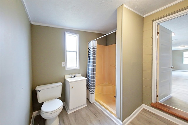 full bath with baseboards, a shower stall, toilet, and wood finished floors