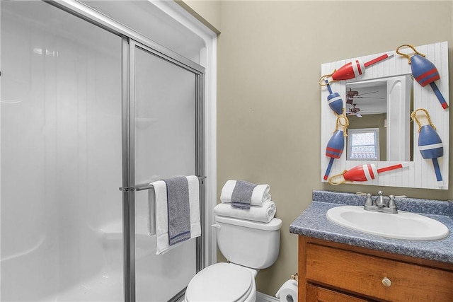 full bathroom with vanity, toilet, and a shower stall