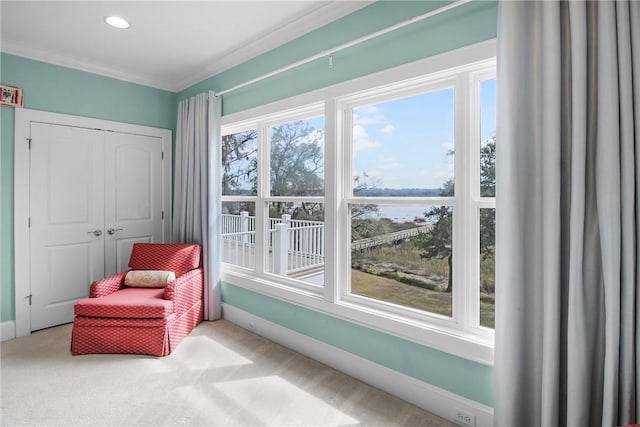 sitting room featuring recessed lighting, crown molding, baseboards, and carpet floors