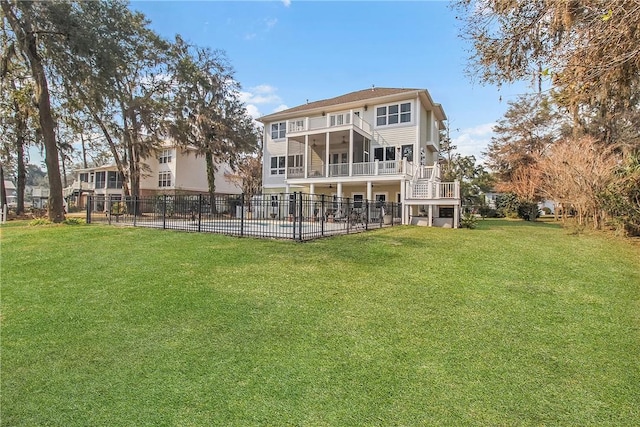 rear view of property with a patio, fence, a yard, a sunroom, and stairs