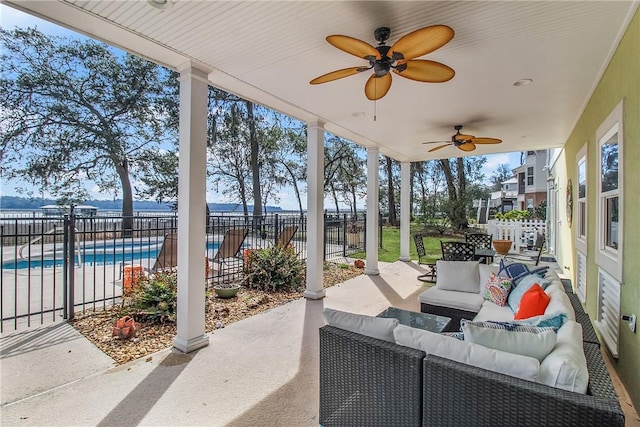 view of patio / terrace featuring a fenced in pool, a ceiling fan, outdoor lounge area, and fence