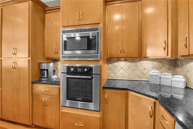 kitchen with brown cabinets, tasteful backsplash, and stainless steel appliances