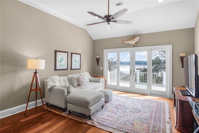 living room featuring visible vents, wood finished floors, baseboards, french doors, and lofted ceiling