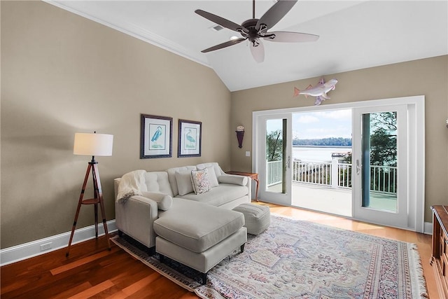 living room with lofted ceiling, wood finished floors, baseboards, and ceiling fan