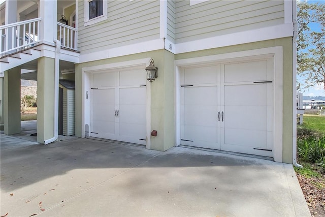 garage with concrete driveway