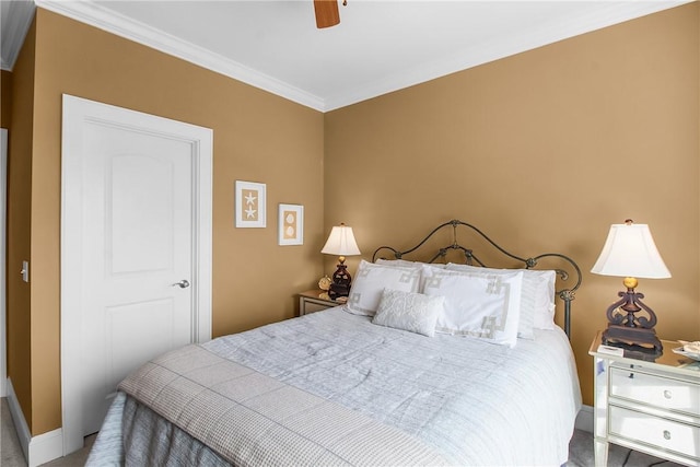 bedroom with a ceiling fan, crown molding, and baseboards