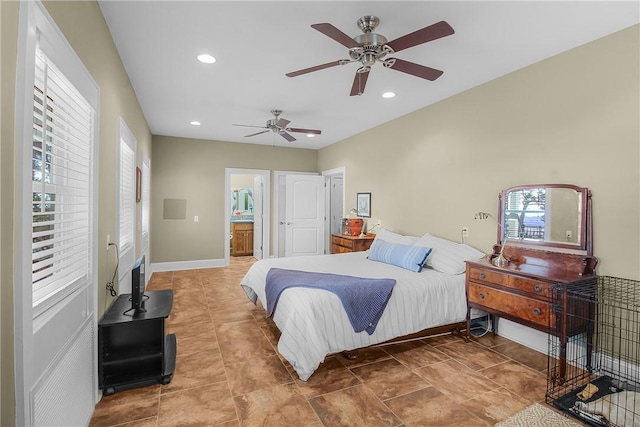 bedroom with recessed lighting, ensuite bathroom, baseboards, and ceiling fan