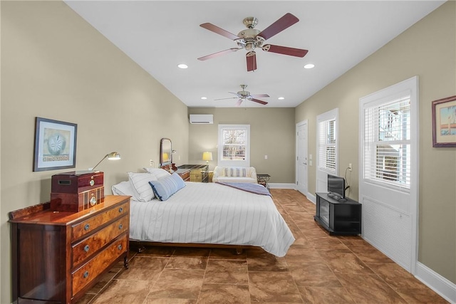 bedroom featuring recessed lighting, a wall mounted air conditioner, baseboards, and a ceiling fan