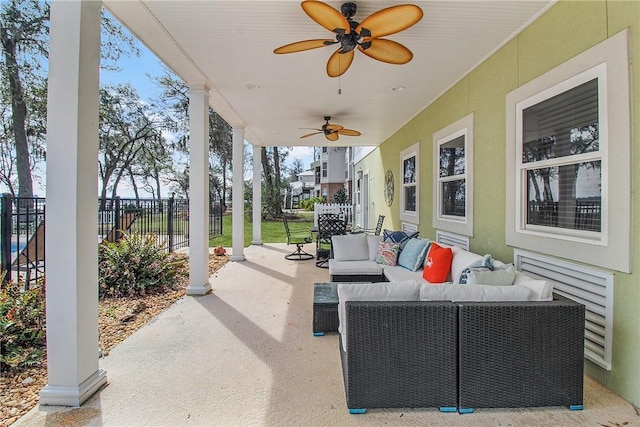 view of patio featuring a ceiling fan, outdoor lounge area, and fence