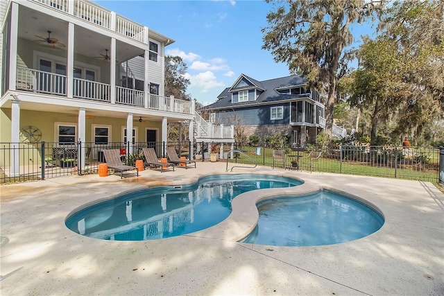 view of pool with a ceiling fan, a patio area, fence, and a fenced in pool