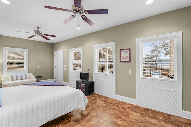 bedroom with a ceiling fan, recessed lighting, and baseboards