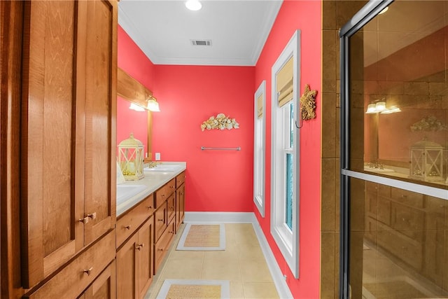 full bath featuring tile patterned floors, visible vents, a sink, a shower stall, and double vanity