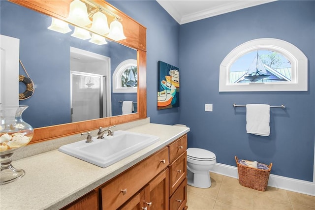 full bath with a stall shower, crown molding, tile patterned flooring, baseboards, and vanity