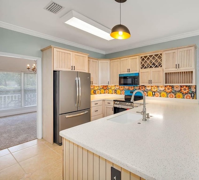 kitchen featuring appliances with stainless steel finishes, ornamental molding, sink, hanging light fixtures, and light tile patterned flooring