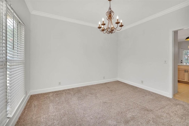 unfurnished room with light carpet, ornamental molding, and a notable chandelier