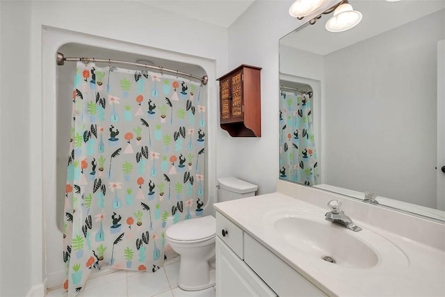 bathroom featuring tile patterned floors, vanity, a shower with shower curtain, and toilet