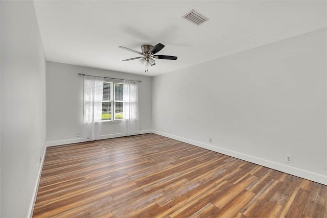 spare room featuring ceiling fan and wood-type flooring