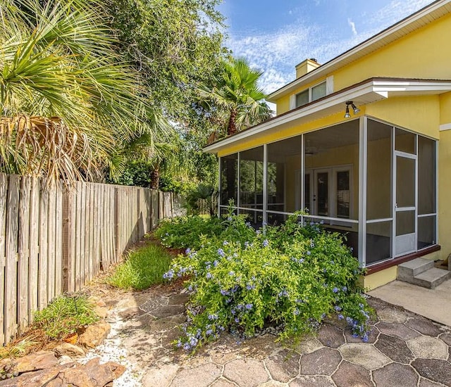 view of yard featuring a sunroom