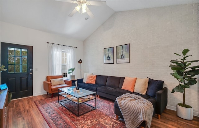 348 Moss Creek Ln, Brunswick, GA 31522 - living room featuring wood finished floors, a ceiling fan, high vaulted ceiling, and brick wall