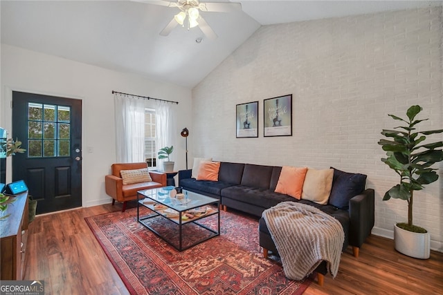 348 Moss Creek Ln, Brunswick, GA 31522 - living area with wood finished floors, a ceiling fan, high vaulted ceiling, and brick wall