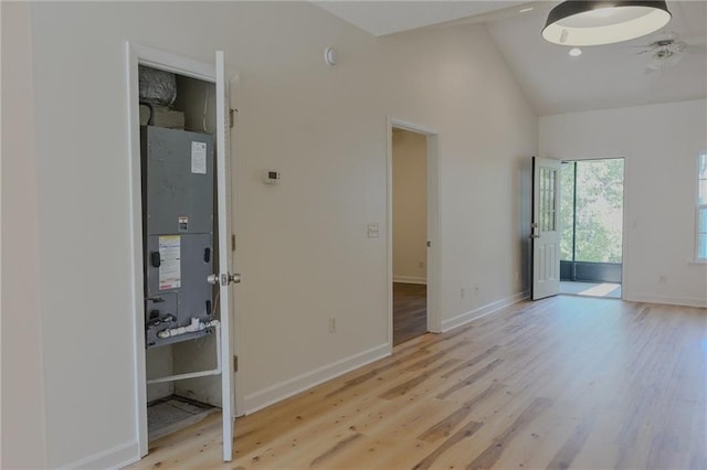 348 Moss Creek Ln, Brunswick, GA 31522 - unfurnished room featuring light wood-style floors, a ceiling fan, high vaulted ceiling, and heating unit