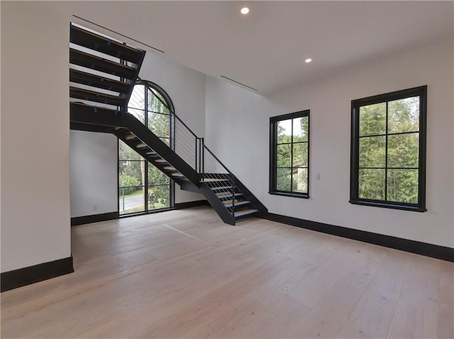 unfurnished living room with light wood-type flooring