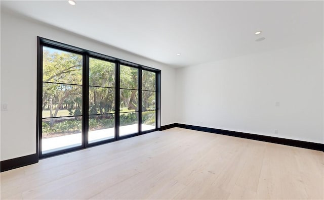 empty room with light wood-type flooring