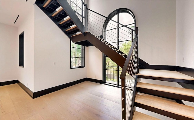 stairs with wood-type flooring