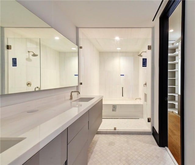 bathroom featuring vanity and a tile shower