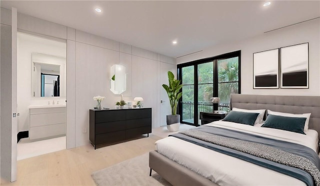 bedroom featuring access to outside, light hardwood / wood-style floors, and ensuite bath