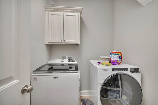 laundry room with separate washer and dryer