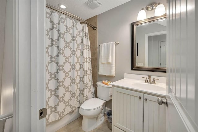 bathroom featuring vanity, visible vents, tile patterned floors, toilet, and shower / tub combo with curtain