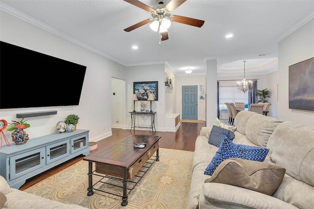 living room with crown molding, recessed lighting, wood finished floors, and baseboards