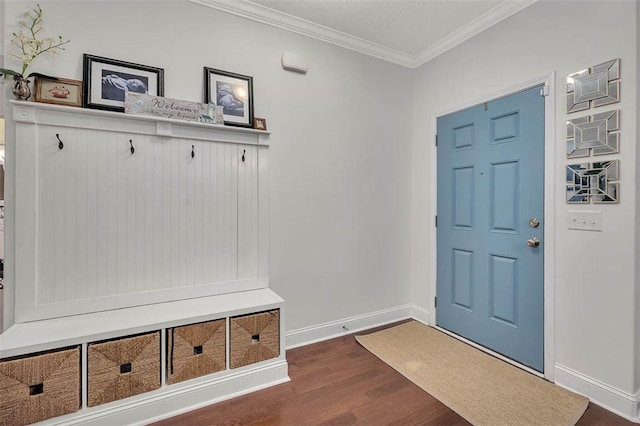 mudroom with dark wood-style floors, baseboards, and ornamental molding