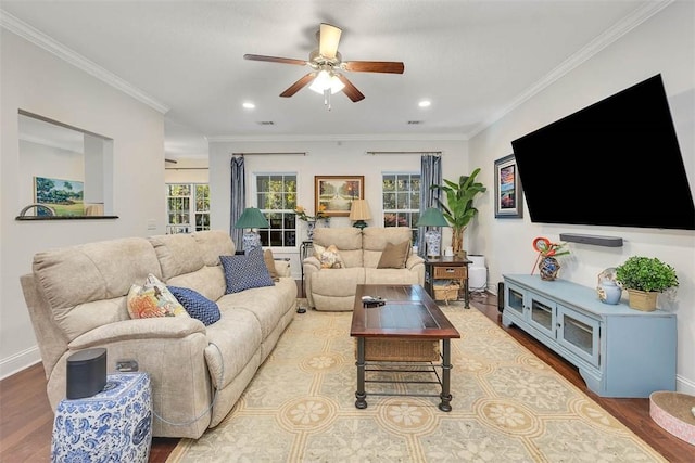 living room featuring wood finished floors, baseboards, recessed lighting, ceiling fan, and ornamental molding