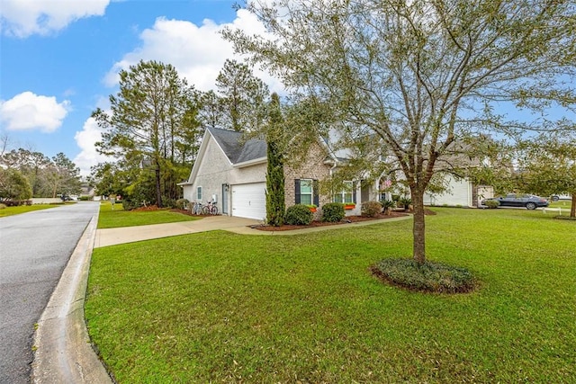 view of front of home with a garage, a front yard, brick siding, and driveway