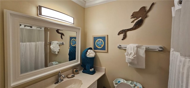 bathroom with crown molding and vanity