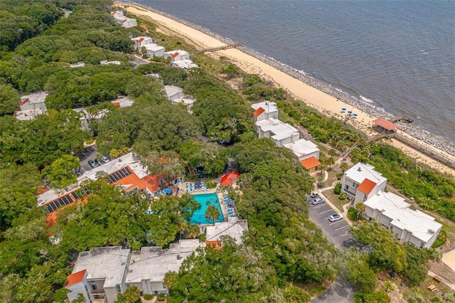 drone / aerial view featuring a water view and a beach view