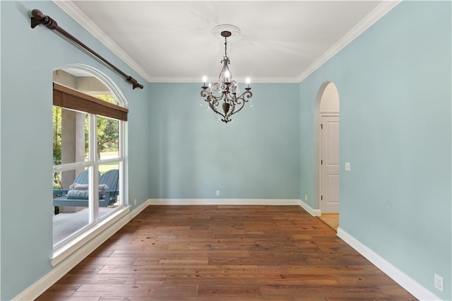 114 Wedge Wood Ct, Brunswick, GA 31525 - unfurnished room with arched walkways, a chandelier, ornamental molding, wood finished floors, and baseboards