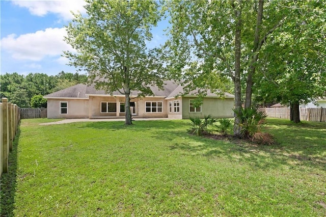 114 Wedge Wood Ct, Brunswick, GA 31525 - rear view of property with stucco siding