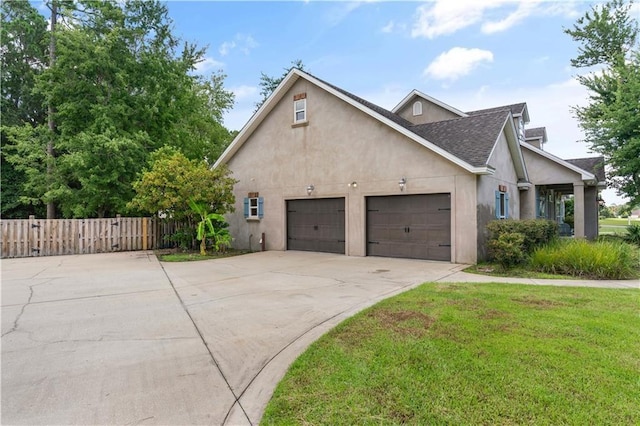 114 Wedge Wood Ct, Brunswick, GA 31525 - view of front of property featuring stucco siding, a garage, concrete driveway, and a shingled roof