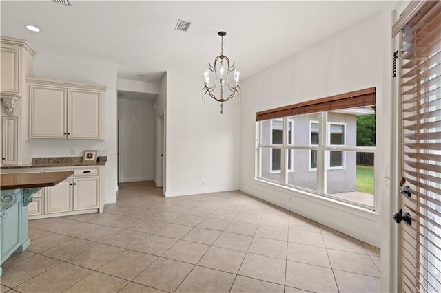 114 Wedge Wood Ct, Brunswick, GA 31525 - unfurnished dining area featuring a chandelier, light tile patterned flooring, baseboards, and recessed lighting