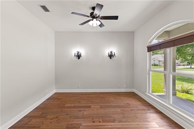 114 Wedge Wood Ct, Brunswick, GA 31525 - spare room featuring hardwood / wood-style floors, ceiling fan, and baseboards